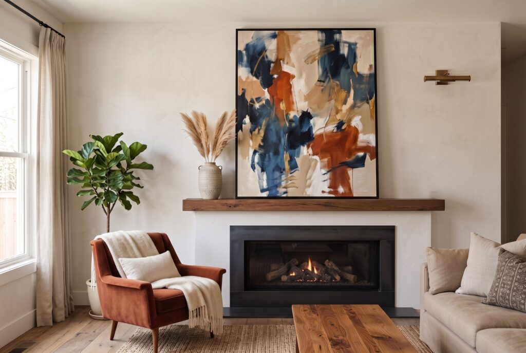 Modern fireplace ideas with oversized abstract artwork above sleek linear fireplace mantel.