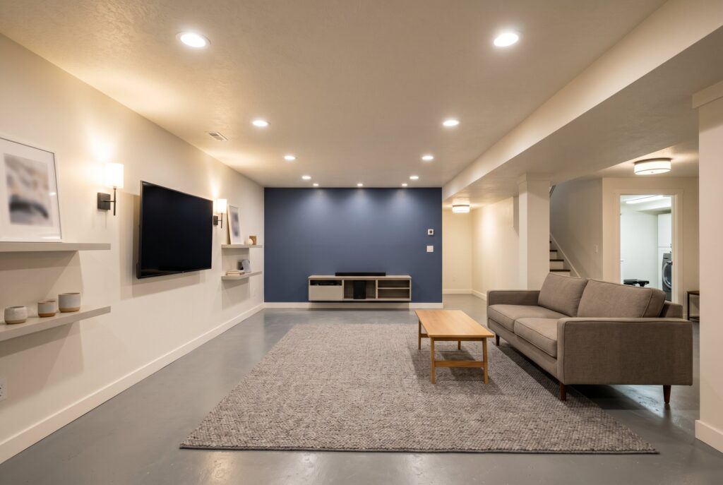 Basement family room with balanced recessed lighting following the 50 lumen rule.