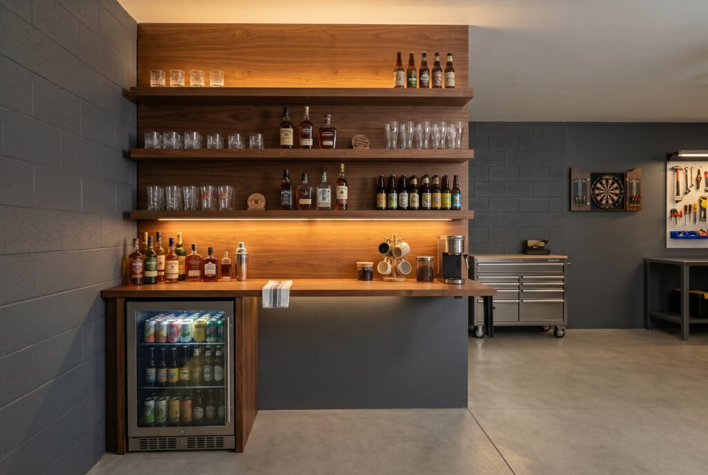 One wall walnut pub with floating shelves, beverage fridge, and illuminated bottle display. 