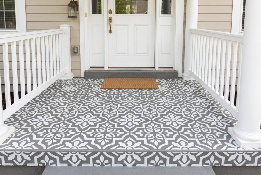 Stenciled concrete porch floor with Moroccan pattern and budget friendly porch makeover.