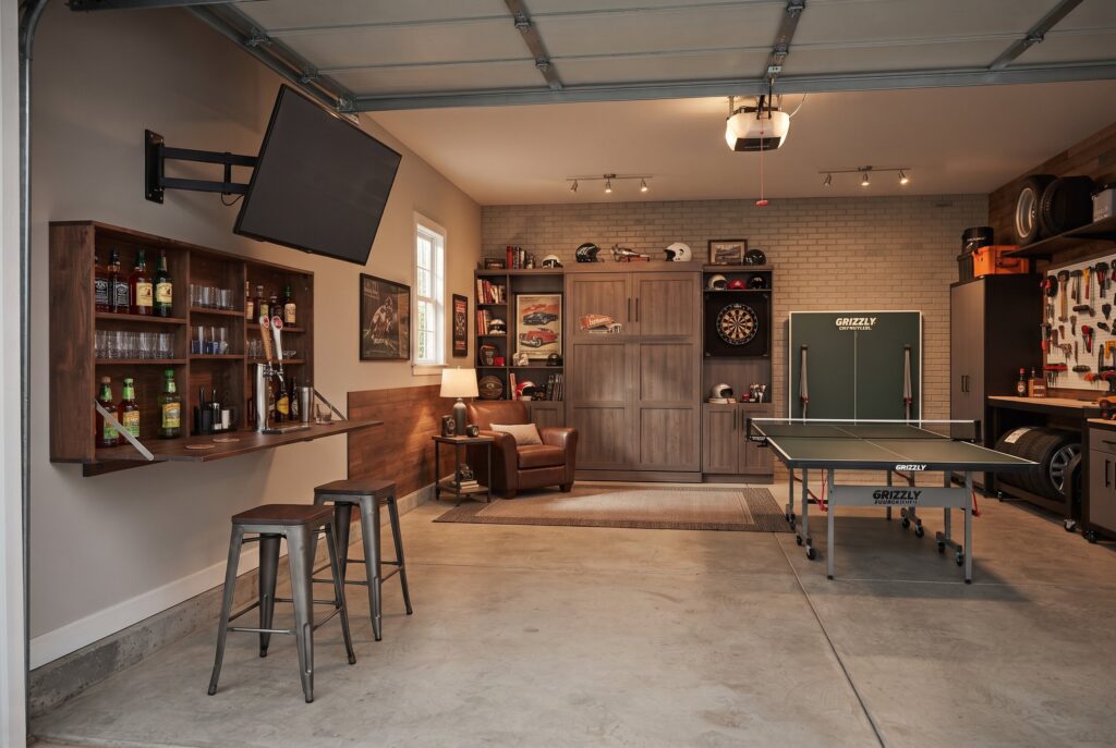 Fold away garage man cave with wall mounted bar, swivel TV, and flexible multipurpose layout.
