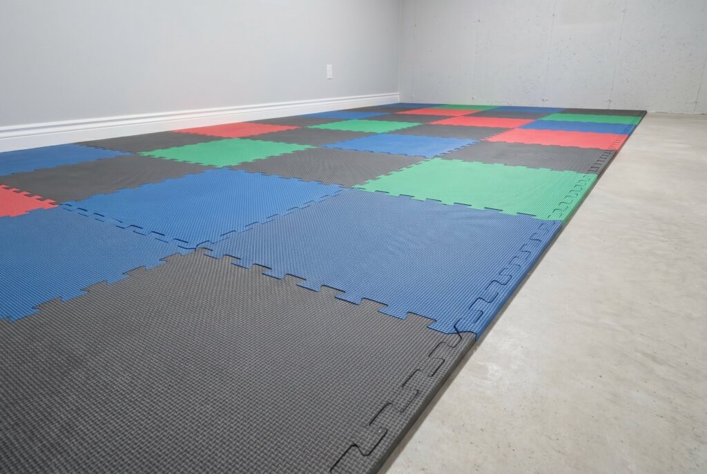 Waterproof interlocking foam tiles creating soft flooring for basement playroom and workout space.